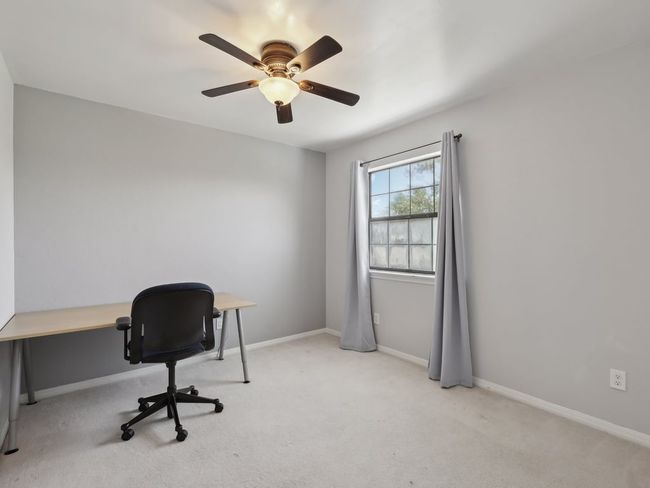 Office space with baseboards, a ceiling fan, and carpet floors | Image 27