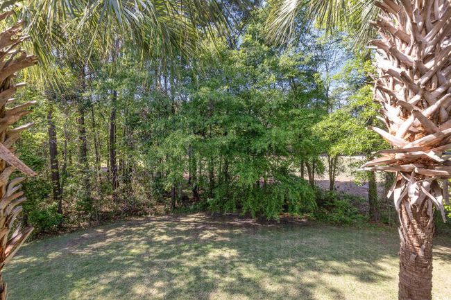 Surrounding community with a yard and view of golf course | Image 32