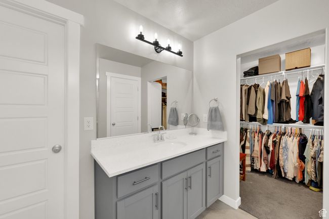 Bathroom featuring vanity and a walk in closet | Image 20