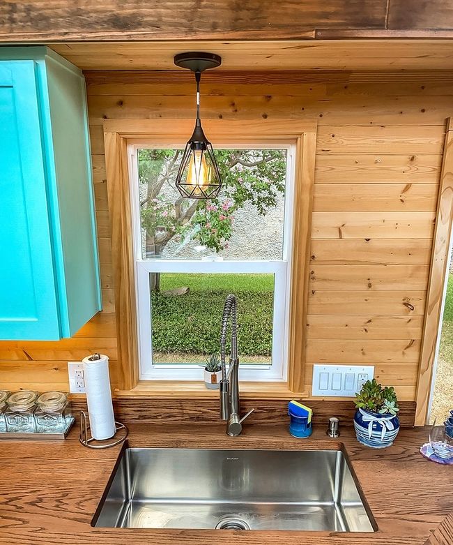Kitchen view of wood walls and decorative light fixtures | Image 22