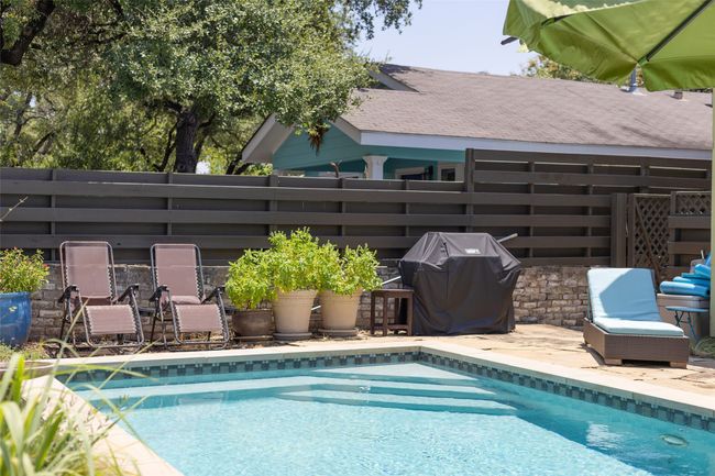 View of pool with area for grilling | Image 39