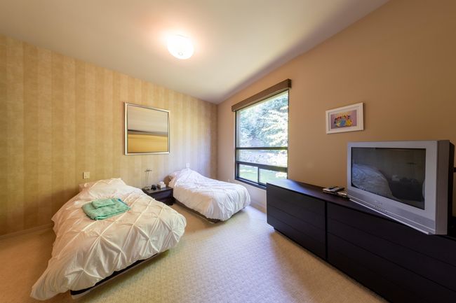 Bedroom with carpet flooring and baseboards | Image 26