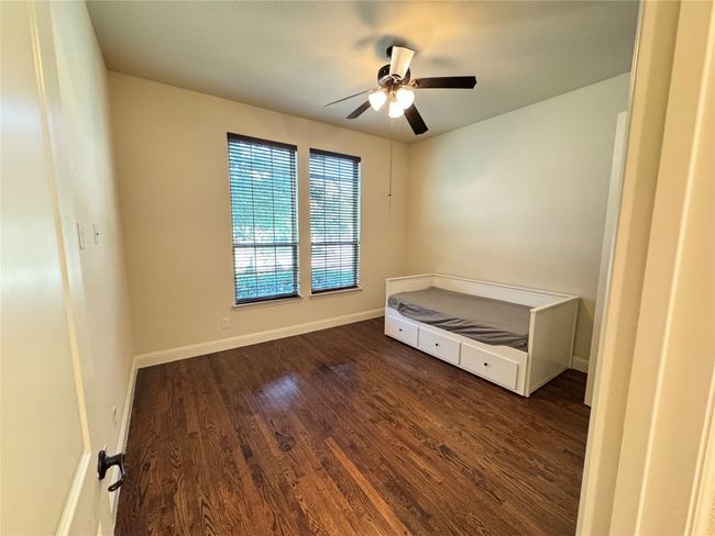 guest room downstairs with ceiling fan | Image 18