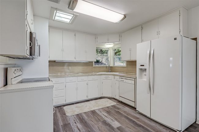 Bright Lighting, ample cabinetry for your kitchen essentials, refrigerator, electric range, microwave and dishwasher | Image 8