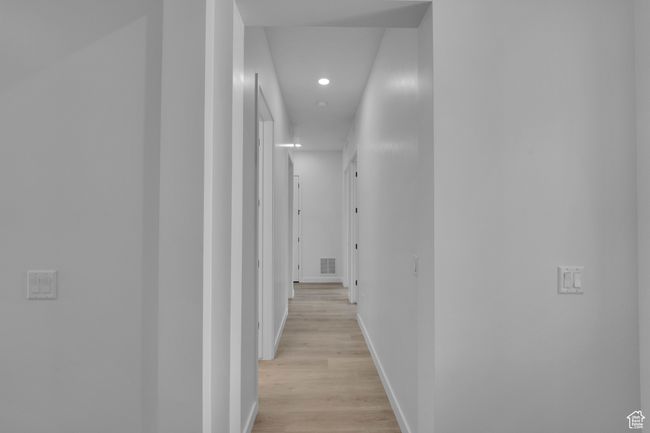 Hall with recessed lighting, light wood-style floors, and baseboards | Image 18