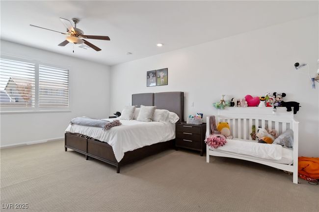 Carpeted bedroom with a ceiling fan, recessed lighting, and baseboards | Image 24