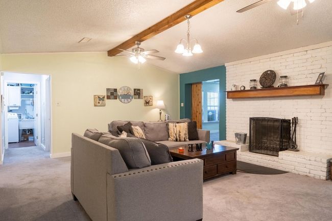 Spacious family room upon entry into the home. | Image 8