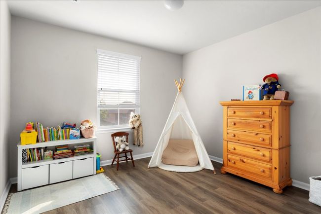 Rec room featuring wood finished floors and baseboards | Image 21