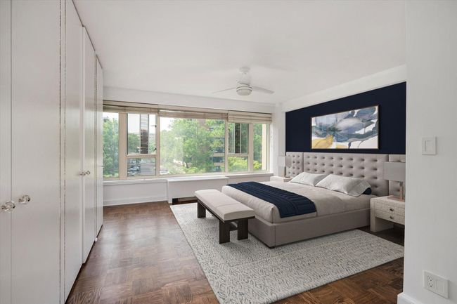Virtually Staged Bedroom featuring baseboards and a ceiling fan | Image 12