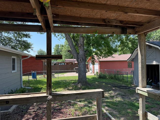View of yard featuring a storage unit | Image 15