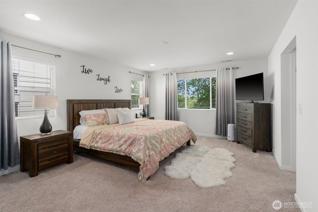 Generous primary suite, offering ample space for king-sized furnishings! This is your private oasis—ideal for starting and ending each day in relaxation. | Image 19