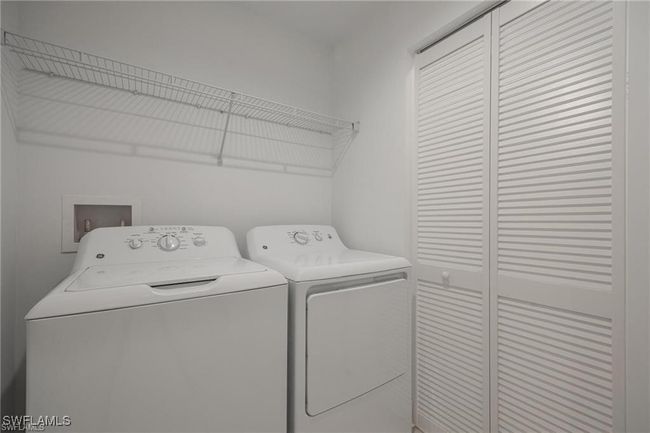 Washroom featuring independent washer and dryer and laundry area | Image 25