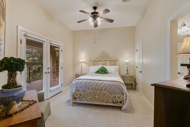 UPSTAIRS Bedroom with access to exterior, light carpet, ceiling fan, walk-in closet, and access to Jack-n-Jill bathroom. | Image 22