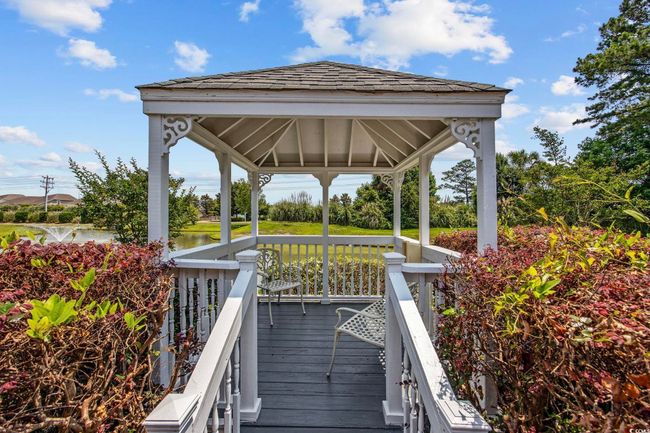 Wooden terrace featuring a gazebo and a water view | Image 24