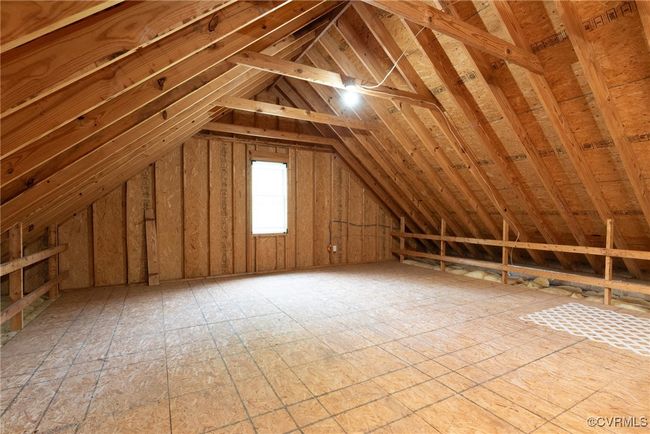 Large walkup attic built with room trusses for easy expansion to finished room or for great storage as is | Image 37