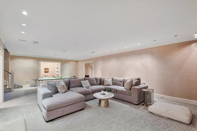 Elegant lower level carpeted room with recessed lighting; plenty of space for enjoying fun times. | Image 23