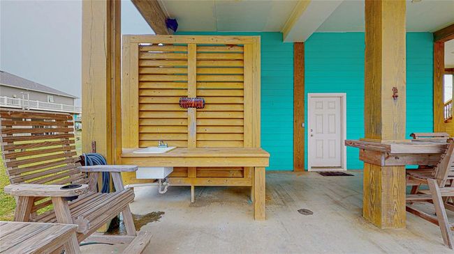 This convenient outdoor sink at the beach house is perfect for cleaning your catch of the day. Located just steps from the water, it offers an easy spot to rinse off fish, gear, or even sand, keeping the mess out of the house! | Image 6