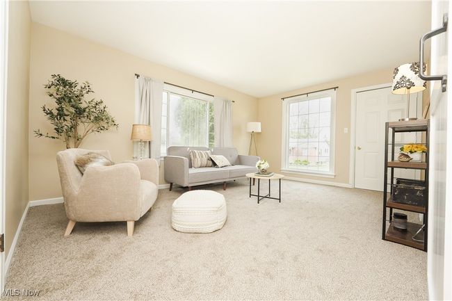 Carpeted living room featuring baseboards | Image 14