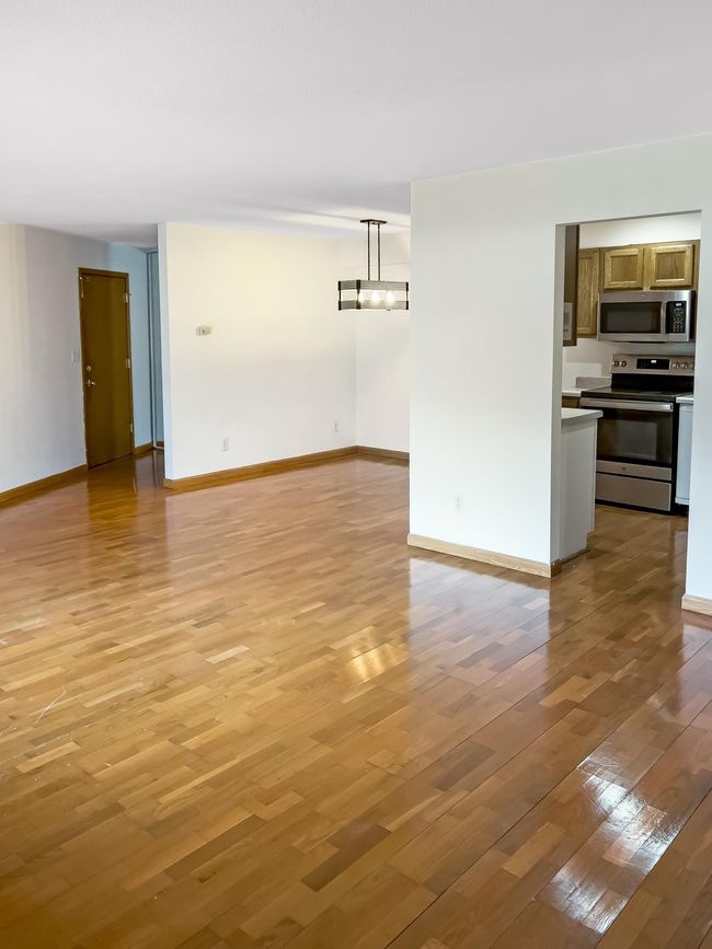 5440 Three Points Blvd -view of front door/dining/kitchen from living room | Image 9