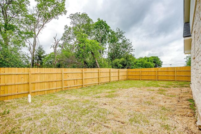 View of yard featuring a fenced backyard | Image 35