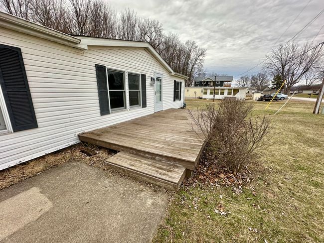 Concrete Sidewalk leads up to decking | Image 4