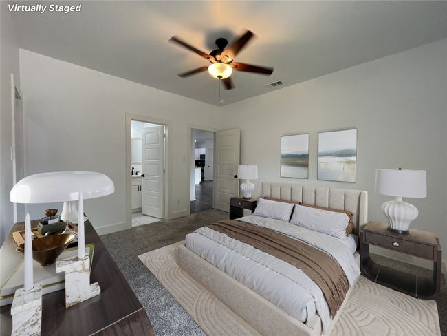 Bedroom with carpet, baseboards, connected bathroom, and a ceiling fan | Image 24