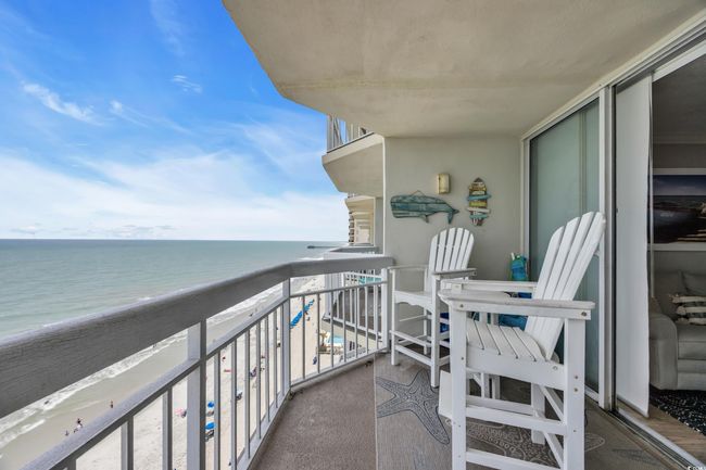 Balcony featuring view of water and beach | Image 19
