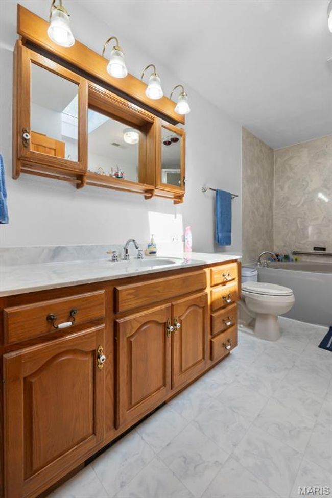Bathroom featuring vanity and a bathtub | Image 71