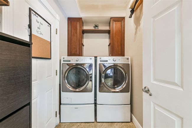 Convenient laundry room off the kitchen, complete with washer and dryer included. | Image 21