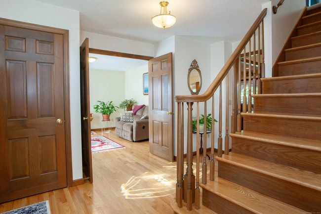 Front foyer with newly finished hardwood floors. | Image 14