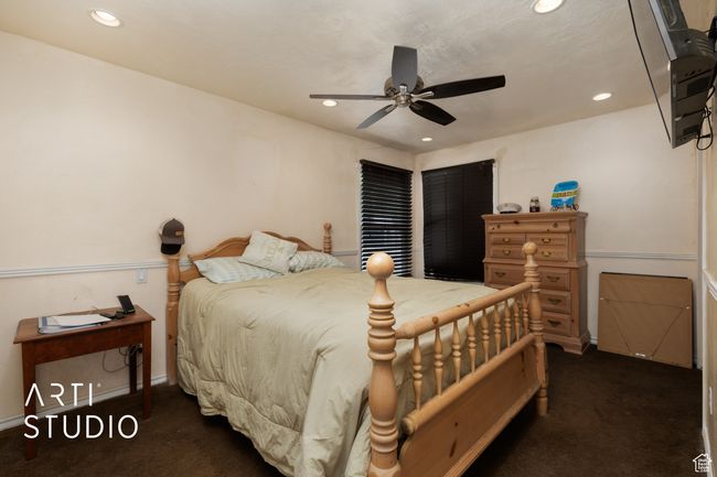 Bedroom with carpet flooring, recessed lighting, baseboards, and a ceiling fan | Image 43