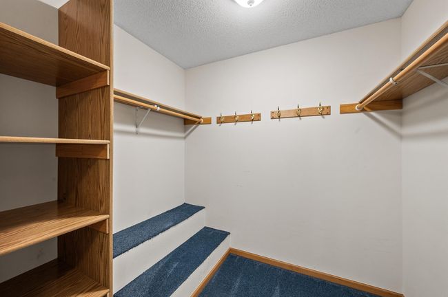Very large walk-in closet | Image 18