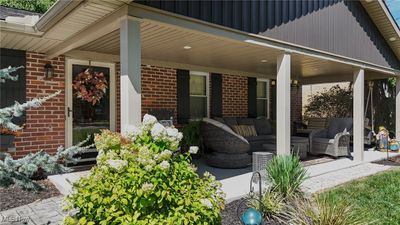 View of patio with covered porch and outdoor lounge area | Image 3