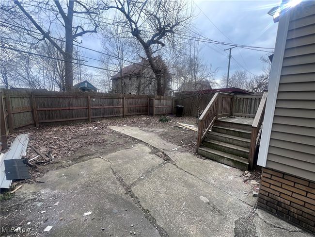 View of yard with a fenced backyard and a patio | Image 6