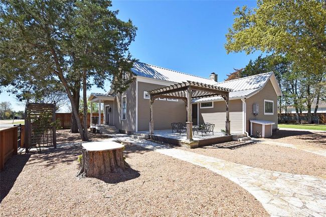 This is a view of the Guest house. The pergola porch makes a great place to relax. | Image 30