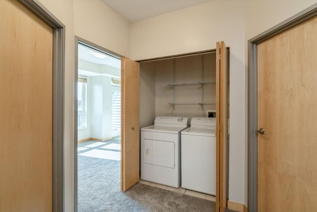 There is a full sized washer and dryer in the unit. (The photos are of unit 401. Owned by the same person and finishes that are VERY similar) | Image 14