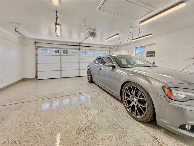 Garage with baseboards and a garage door opener | Image 42