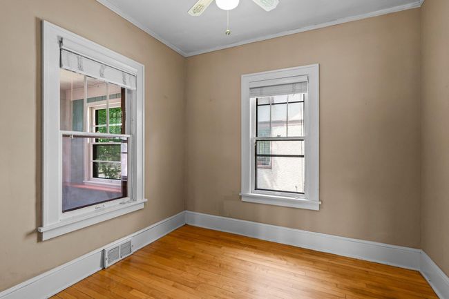 This well-appointed main-floor bedroom offers versatility and comfort, ideal for guests & family members. | Image 6