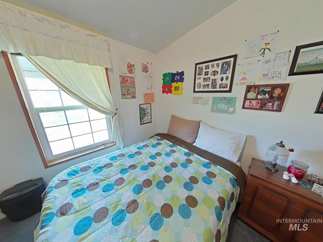 Bedroom featuring vaulted ceiling | Image 14