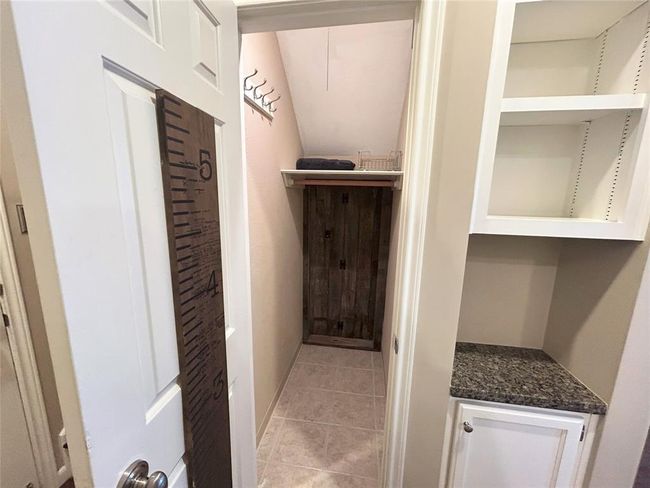 LOTS of storage in this condo! There's an additional built in just beside the door to the closet for even more storage. | Image 25