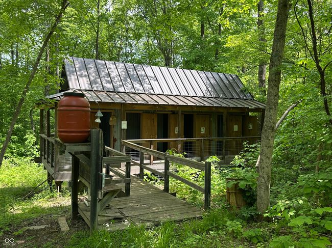view of front of property featuring a standing seam roof, metal roof, an outbuilding, and an exterior structure | Image 15