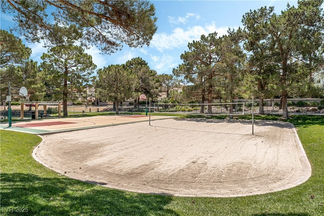 View of home's community featuring a lawn, volleyball court, and community basketball court | Image 44