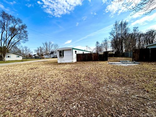504 Locust St, Howard City, MI, 49329-9436 | Card Image