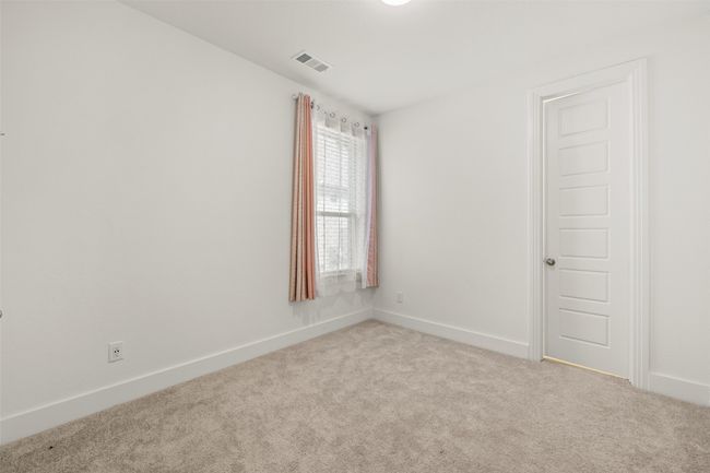 Empty room featuring baseboards, visible vents, and carpet | Image 11