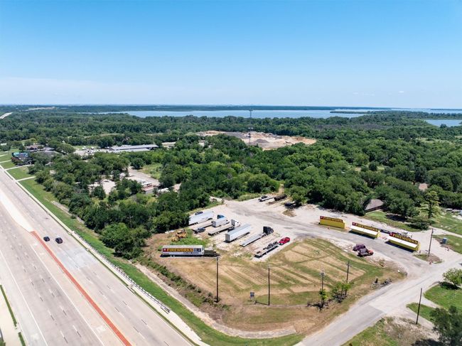 Bird's eye view of a large body of water and a main thoroughfare | Image 5