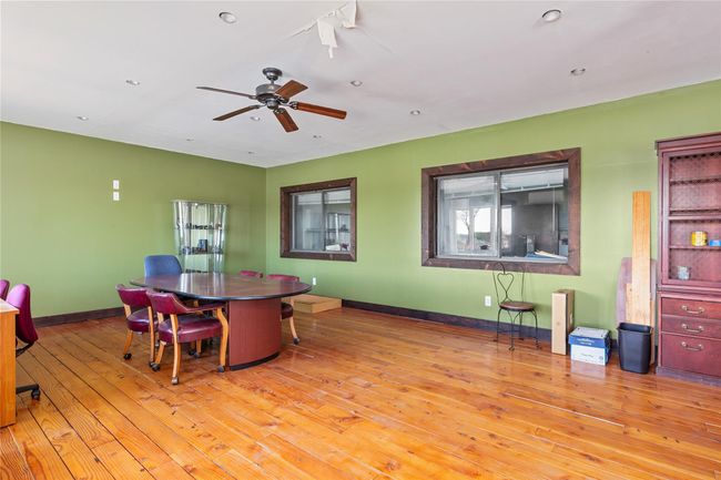 Dining space with ceiling fan and light wood-type flooring | Image 22