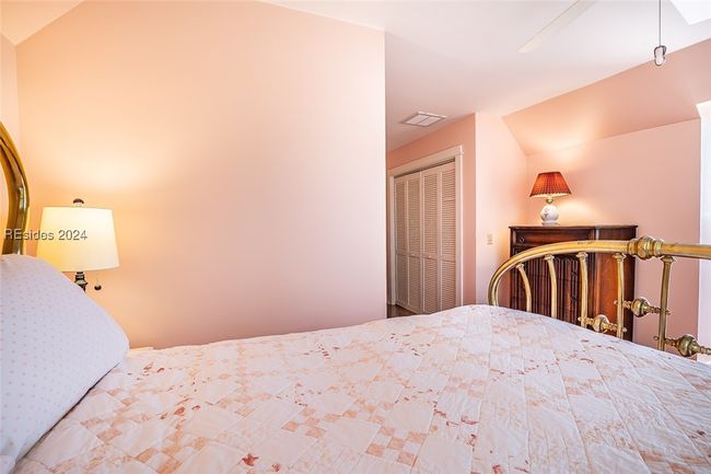 Bedroom featuring lofted ceiling, ceiling fan, and a closet | Image 36