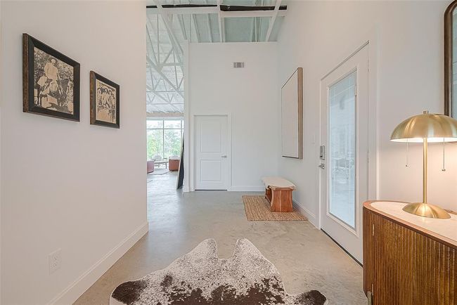 View looking in, standing at the front door. Garage door to the right. | Image 4