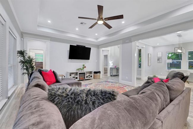 Spacious and inviting living area perfect for relaxation and entertaining. | Image 13