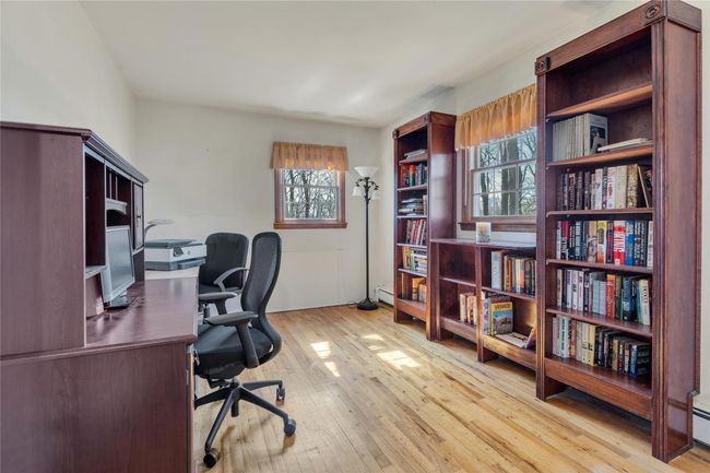 Office area with a baseboard radiator and wood-type flooring | Image 16